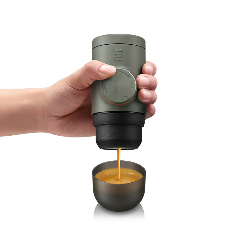 Camping Coffee Machine Minipresso Manual Espresso Maker. Compact and portable espresso machine with adjustable basket, eco-friendly design, and double-wall insulation for outdoor adventures.